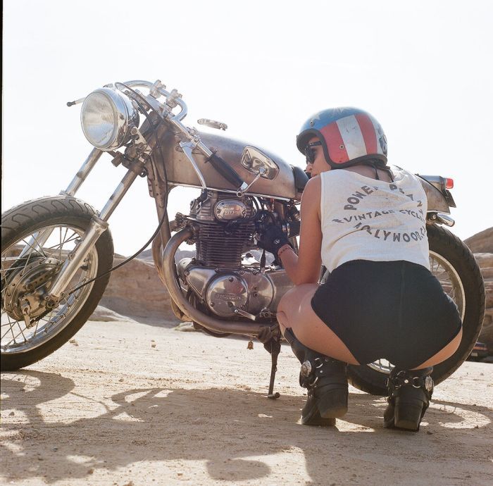 A playful frame from Girls on a motorcycle — online in Mexico City